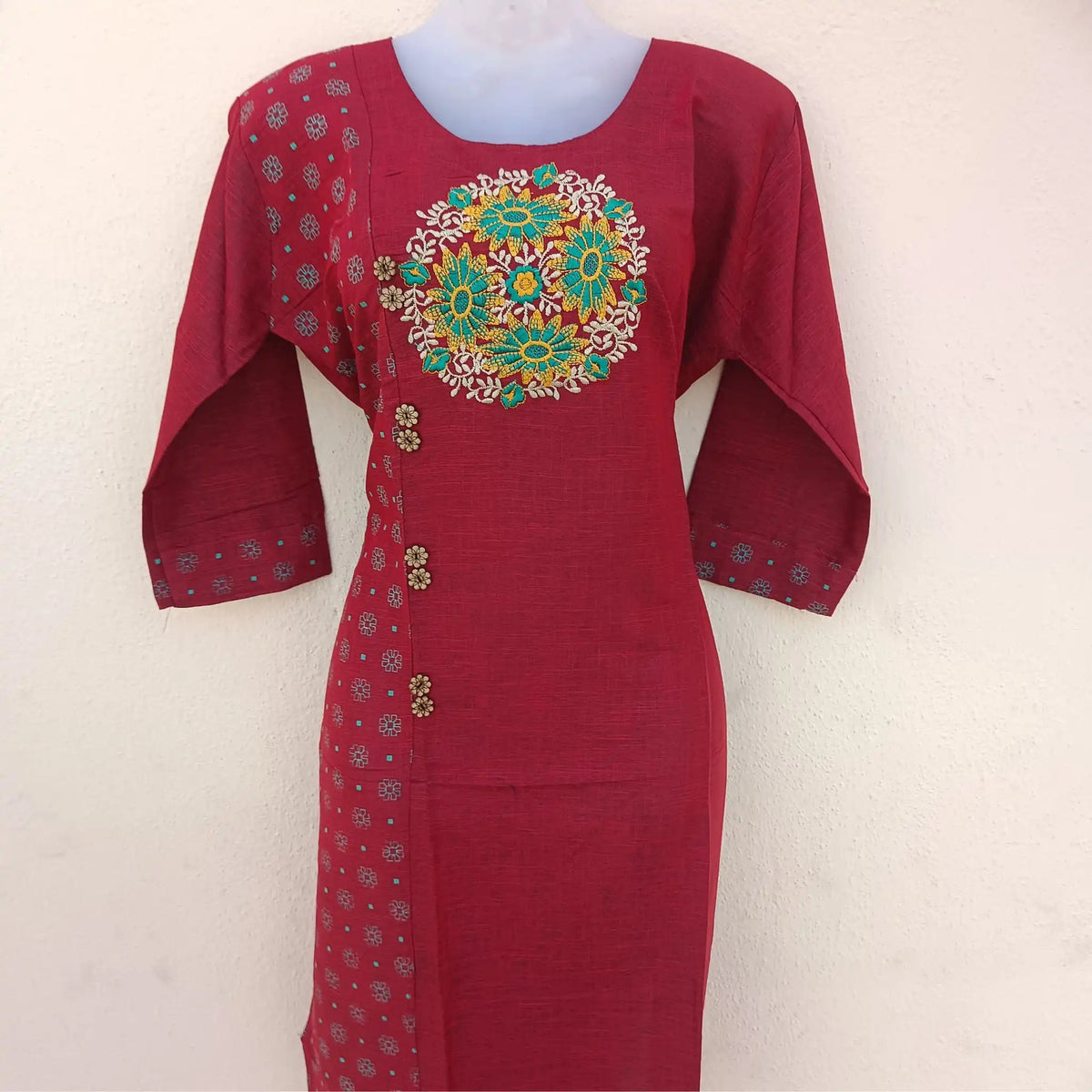 Woman donning a brick red embroidered two-tone straight cut kurta exuding elegance