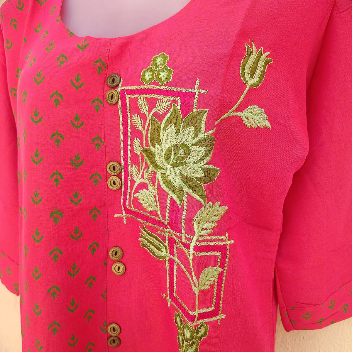 Lady dressed in regal maroon two-tone kurta with intricate embroidery for a sophisticated look