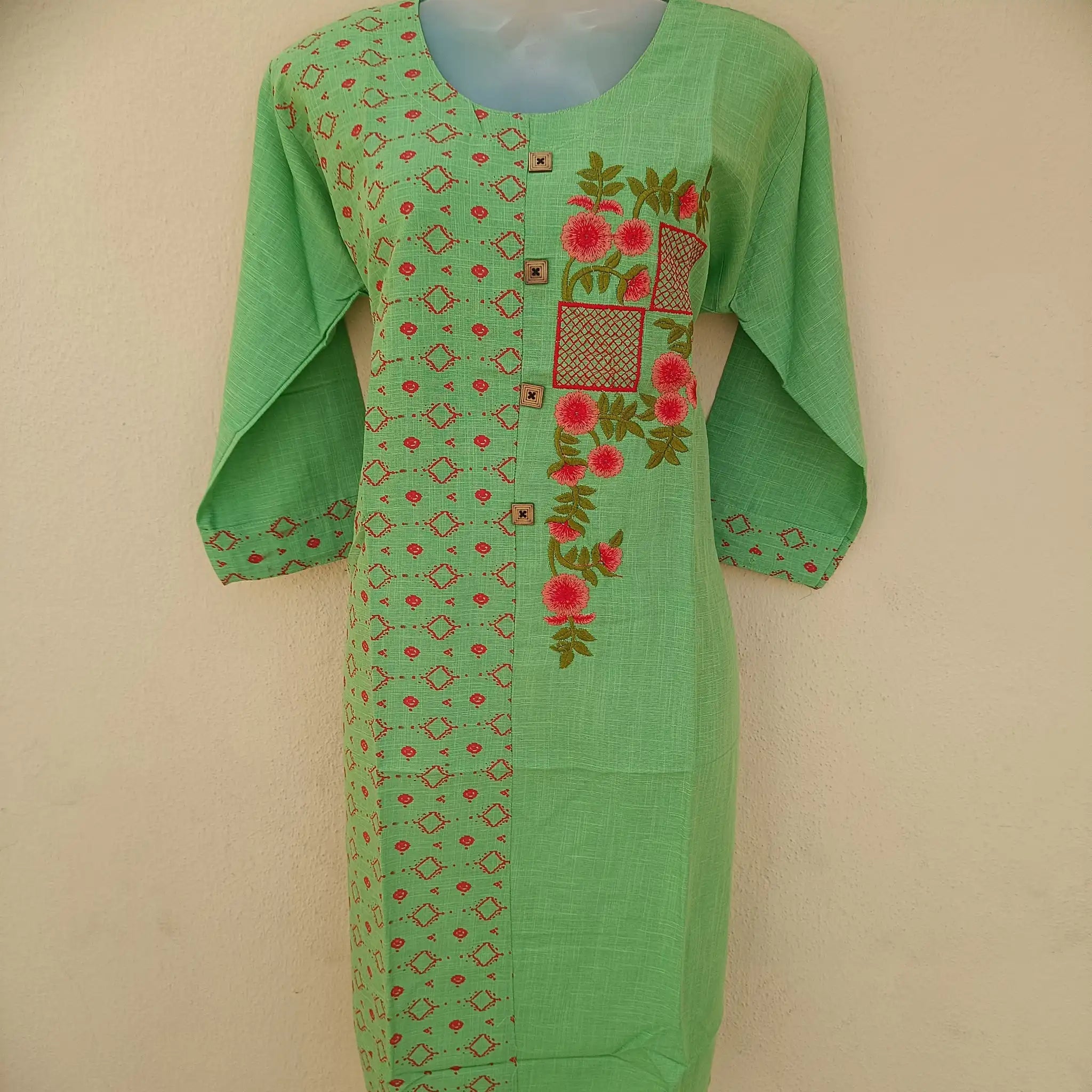 Woman epitomizing grace in a pista green two-tone straight cut kurta with ornate embroidery