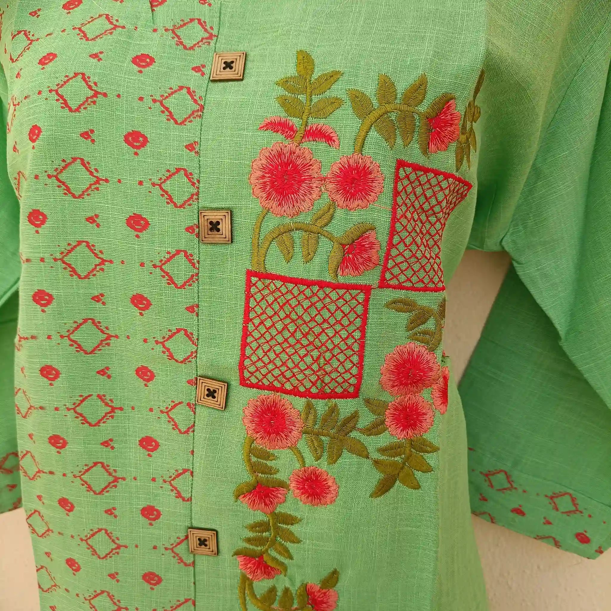 Woman epitomizing grace in a pista green two-tone straight cut kurta with ornate embroidery